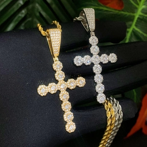 Close-up of hip-hop cross pendants in gold and silver finish with full zircon inlay