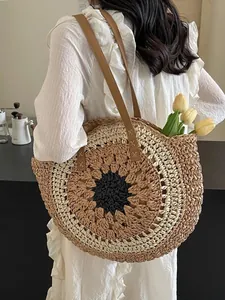 Hollow round paper rope straw beach shoulder bag with chic color-block woven design