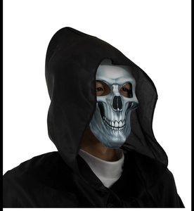 Close-up of Halloween skull mask and black hooded cloak outfit for costume party