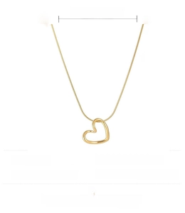 Detail view of a golden stainless steel heart necklace with 39cm plus 5cm extension chain