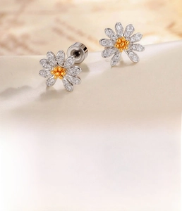 Macro shot of micro-pave zircon daisy earring with titanium steel screw back post