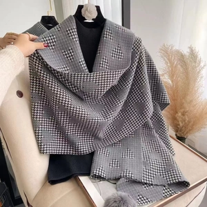 Gray and white houndstooth heart pattern knitted scarf with soft fringe details