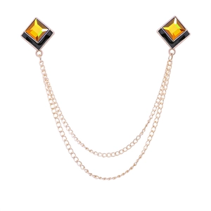 Elegant geometric square collar chain with amber crystal and gold tassels on white background