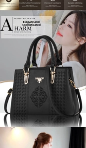 Detailed view of black litchi pattern PU leather bag with floral embroidery and hardware