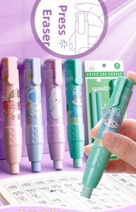 Detail of retractable pen-style erasers in pastel macaron colors with cute cartoon patterns