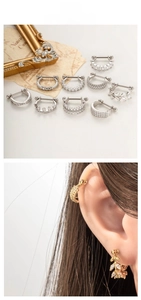 Detailed views of gold and silver U-shaped ear studs with zircon inlays and screw backs