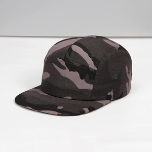 Detail of 5-panel camper hat featuring dark camo pattern and metal ventilation eyelets
