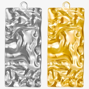Detailed view of rectangular pleated 304 stainless steel pendants in gold and silver
