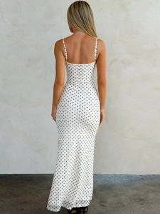 Back view of a French chic white polka dot long dress with slim fit and thin straps