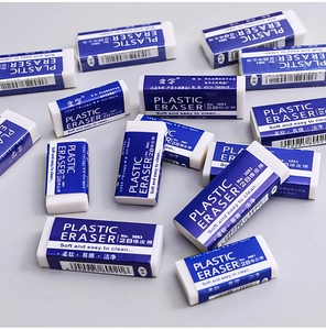 Macro detail of blue and white 2B plastic erasers stacked for clean pencil correction