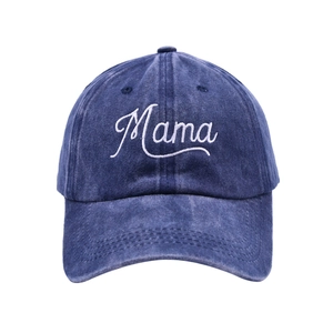 Detailed embroidery of Mama text on a washed navy blue cotton baseball cap crown