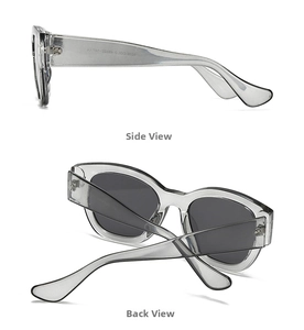 Detail view of oval marble pattern sunglasses with ice gray frames and dark gray lenses