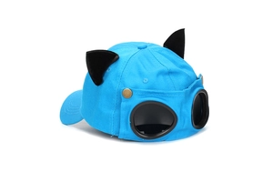 Detail view of sky blue baseball cap with cat ears and integrated aviator goggles