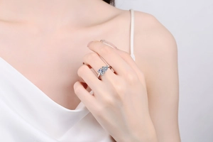 Detailed view of an S925 silver ring featuring three emerald-cut clear moissanite stones