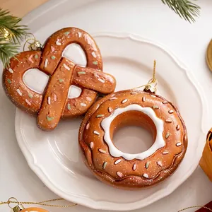Gingerbread style Christmas tree ornaments with pretzel and donut resin designs