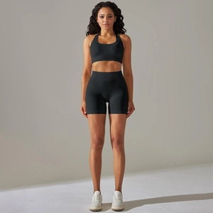 Detail of ribbed waistband on high-waist black seamless yoga shorts for women