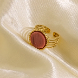 Macro view of 14K gold-plated ring with pink marble stone and beaded edge details