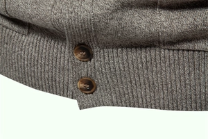 Macro shot of men's knit cardigan showing textured fabric and resin buttons