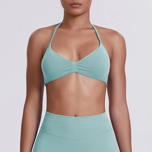 Detail of light blue seamless yoga set with halter v-neck bra and high waist leggings