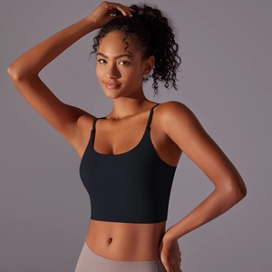 Detail of black thin strap yoga vest with deep scoop neck and soft elastic fabric