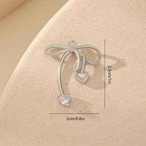 Detailed size view of silver bowknot pendant with heart zircon 2.5cm by 2cm dimensions