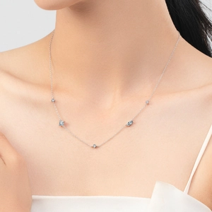 Elegant S925 sterling silver clavicle necklace with sparkling zircons on female model