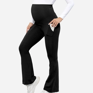 Detail view of high waist maternity flare pants with supportive belly band and side pockets