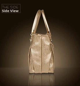 Side view of golden tote bag featuring glossy chain-link pattern and cylindrical handles