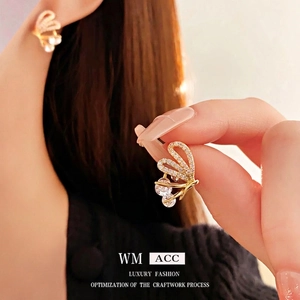Gold plated butterfly stud earrings with sparkling cubic zirconia crystals and round stones