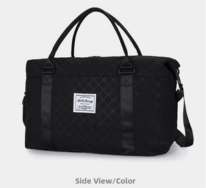 Close-up of black quilted gym bag with adjustable shoulder strap and woven logo detail