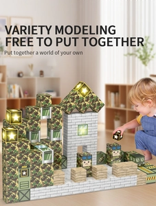 Close-up of military-themed magnetic building blocks with LED lights and child playing