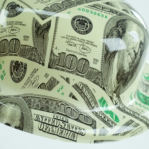 Detail of dollar bill print on high-strength plastic top hat with mirror finish