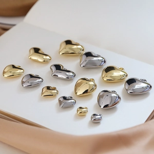 Polished heart shaped resin pendants in gold and silver for DIY jewelry making