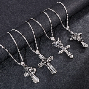 Vintage stainless steel pendants with spider, cross, and skull motifs on rope chains