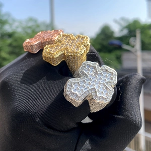 Detail of hip hop cross ring with micro-pave cubic zirconia in gold and silver