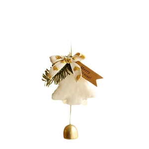Nordic Christmas tree ornament with plush white body, gold bell, and Merry Christmas tag