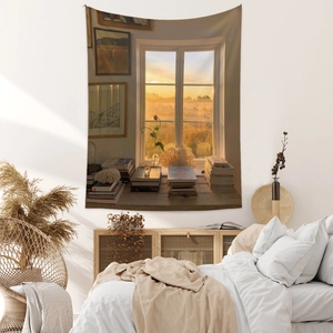Detail of bohemian tapestry featuring a sunset window scene above a cozy bedroom bed