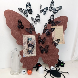 Brown felt butterfly message board with black cutout butterflies for Halloween decor