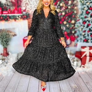 Detail of elegant black sequin maxi dress with V-neck and tiered skirt for parties