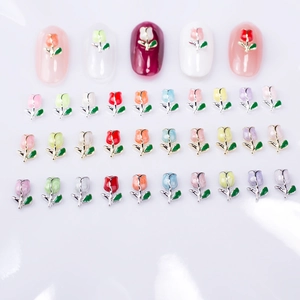 Macro detail of colorful tulip alloy nail charms with enamel finish for DIY manicures