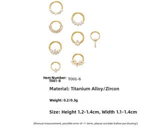 Collection of golden titanium nose rings with various cubic zirconia flower shapes