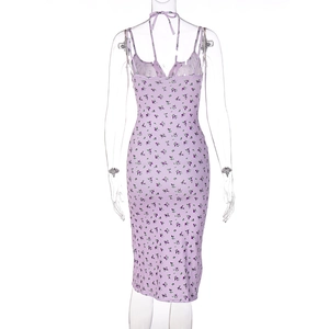 Detail of light purple floral dress back featuring slim straps and a halter neck design