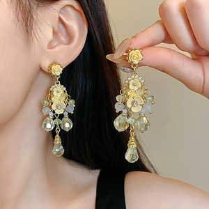Detail of flower tassel earring with cream roses, pearls, and light green crystal beads