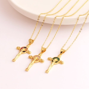 Detailed macro view of 18K gold plated cross pendants with colorful zircon inlay