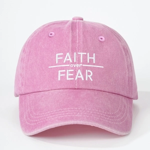 Pink washed cotton baseball cap featuring FAITH over FEAR embroidery in a vintage style