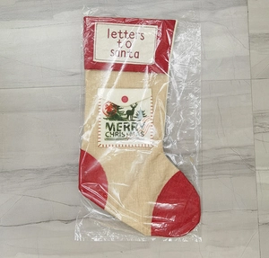Linen Christmas stocking with red envelope pocket and Merry Christmas embroidery detail