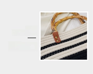 Close-up of woven tote bag with bamboo handle and reinforced gold rivet hardware