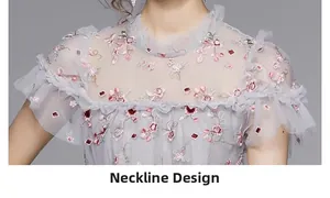 Detail des eleganten Netz-Ausschnitts mit Stickerei und Volants am Luxuskleid