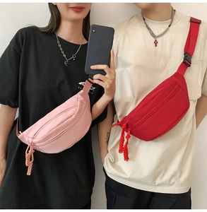 Detail showing pink and red nylon crossbody bags with adjustable straps on models