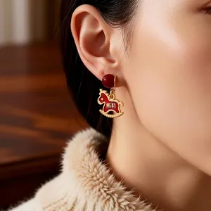 Elegant red enamel rocking horse earrings with gold beads and silver needle studs for women